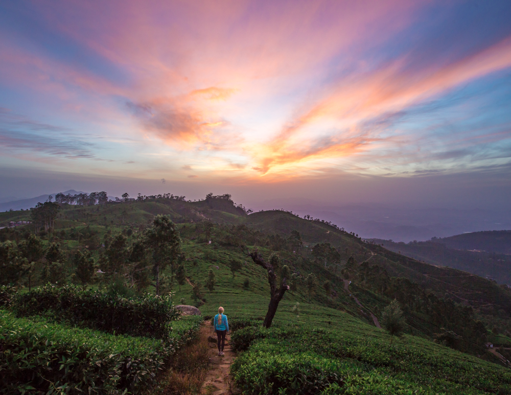 The sunrise view at Lipton's Seat at the mountain city of Haputale where the sky is blue, purple and pink under the sunlight.